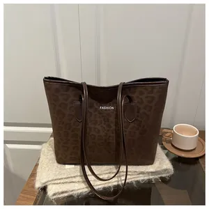 Deep brown leopard print tote bag with white FASHION text and leather straps