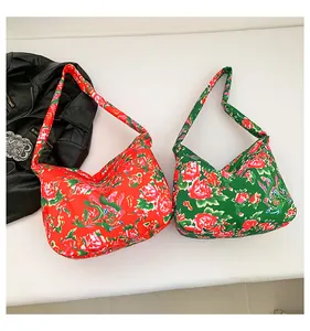 Detail of floral tote bags with traditional Chinese Peony patterns and vibrant red green fabric