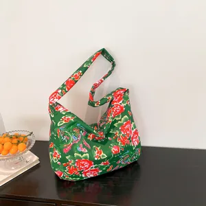 Ethnic style floral tote bag with green and red peony patterns and wide shoulder straps