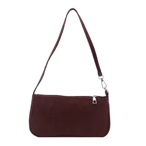 Minimalist burgundy underarm shoulder bag with sleek rectangular shape and silver hardware