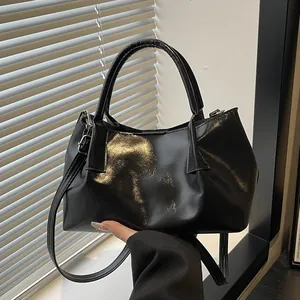 Retro black wrinkled faux leather handbag and crossbody bag with glossy finish
