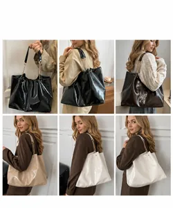 Detail view of large tote bags in four colors with metal chain and PU leather straps