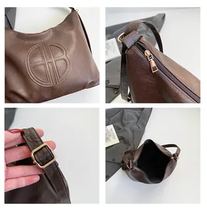Detailed close-up showing vintage leather texture and hardware on dark brown tote bag