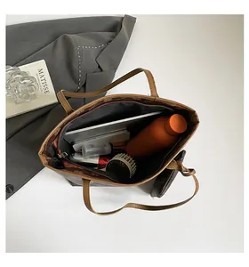 Top view of large printed tote bag interior showing ample space for tablets and water bottle
