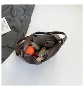 Deep brown retro leather tote bag interior showing large capacity for daily essentials