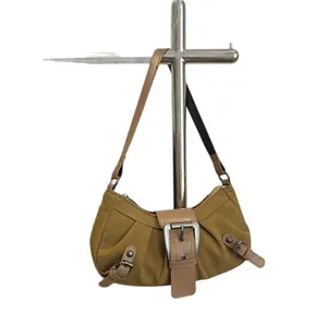 Retro mustard yellow underarm shoulder bag with metal buckle and vintage leather trim