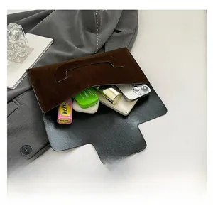 Detail showing the large interior capacity of this dark brown suede envelope clutch bag