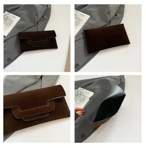 Detail of dark brown suede envelope clutch with unique triple-layer flap design and interior
