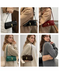Detail showing various colors of retro patent leather shoulder bags with gold clasps