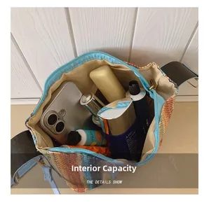 Macro view of woven handbag interior showing spacious capacity and smooth zipper