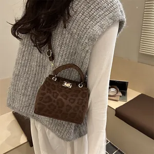 Chic brown leopard print small square bag with gold hardware and top handle strap