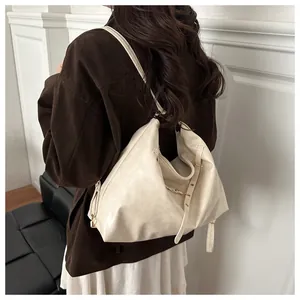 Detail view of the soft matte PU leather and drawstring on a retro beige tote bag