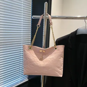 Pink pleated tote bag with golden chain strap and deer pendant for casual commuting
