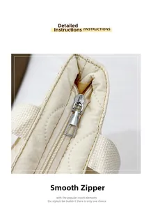 Close-up of smooth metal zipper detail on beige quilted space cotton tote bag