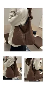 Detail view of a large leopard print hobo shoulder bag with soft suede texture