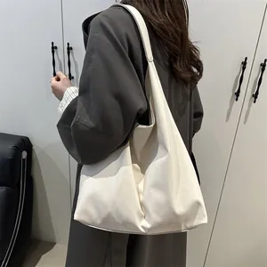 Minimalist beige large capacity tote bag with wide strap and soft texture for women