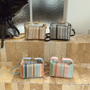 Fashionable straw woven box crossbody bag in brown, black, blue and pink contrast colors