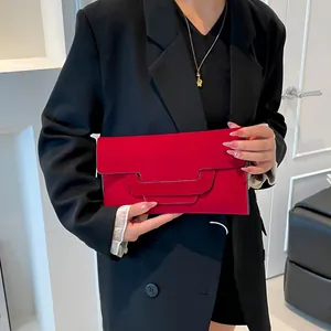 Elegant red suede envelope clutch bag for women featuring a unique layered flap design