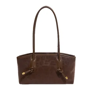 Retro brown oversized tote bag with leopard texture and metallic knot details