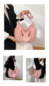 Detailed view of pink corduroy shoulder bag showing side pockets and soft ribbed texture
