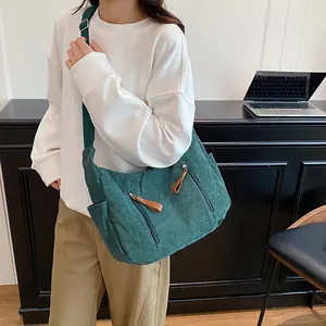 Dark green corduroy crossbody bag with large capacity and adjustable shoulder strap