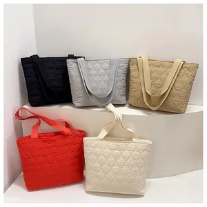 Quilted puffer tote bags in multiple colors featuring classic diamond stitching patterns
