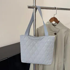 Light blue quilted space cotton tote bag with wave stitching and wide shoulder straps