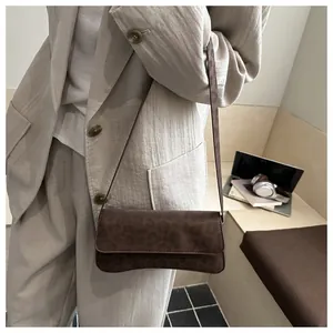 Detail shot of vintage leopard print crossbody bag in suede with animal pattern