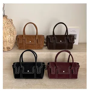 Detailed display of four retro rectangular handbags in brown, black, and burgundy tones