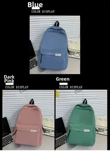 Tre zaini in nylon minimalisti in blu, rosa scuro e verde con cerniera anteriore