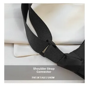 Close-up of adjustable black nylon shoulder strap with durable plastic buckle detail