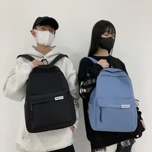 Zaino minimalista in nylon impermeabile nero e blu nebbia per studenti e pendolari