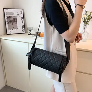 Quilted cylinder crossbody bag in black leather with wide strap for casual wear