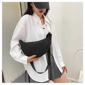 Minimalist black crescent crossbody bag made of durable nylon for daily casual wear