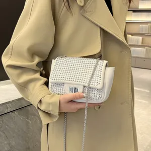 Elegant white square crossbody bag with sparkling rhinestones and silver chain strap