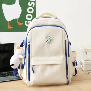 Minimalist creamy white backpack with blue contrast and a cute plush goose pendant