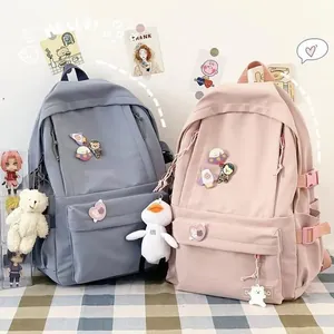 Zaino scolastico bicolore per ragazze con spille astronauta e ciondoli di peluche