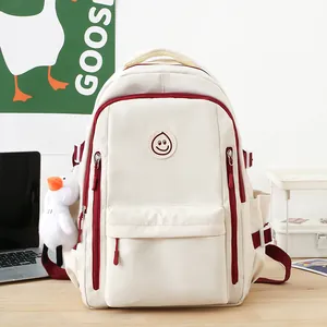 Japanese style large capacity cream backpack with red accents and goose plush charm