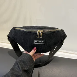 Black corduroy waist bag with gold zippers and adjustable strap for casual daily wear