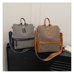 Détails de sacs à dos vintage à motif pied-de-poule noir et marron avec finitions cuir