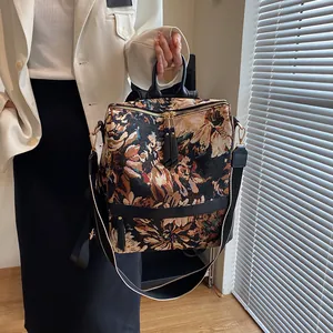 Sac à dos rétro à motifs floraux avec bandoulière rayée et finitions en cuir noir élégant