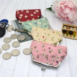 Vintage floral cotton coin purses with metal clasps in pink, beige, green, and red colors