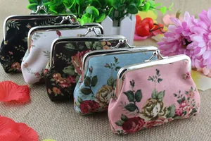 Detailed view of floral canvas coin purses with vintage rose patterns and metal clasps