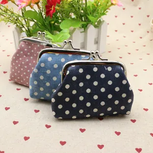 Polka dot canvas coin purse with metal kiss lock in navy blue, light blue, and pink colors