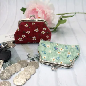 Floral fabric coin purse with vintage kiss-lock metal frame in burgundy and green colors