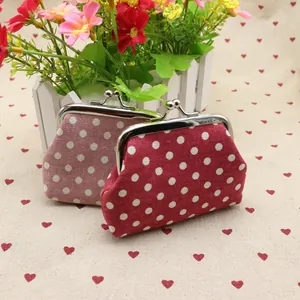 Retro polka dot coin purses in red and pink colors with metal clasp closure detail