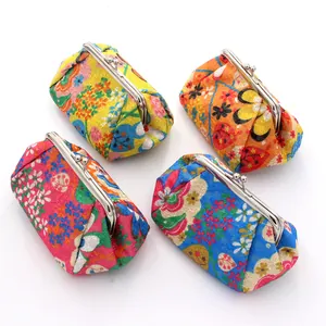 Detailed view of colorful floral fabric coin purses with vintage metal kiss-lock frames