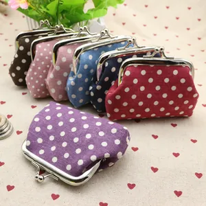 Detailed view of assorted retro polka dot coin purses with vintage metal clasps