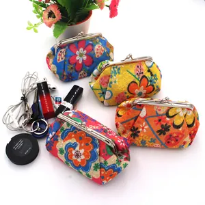 Detailed close-up of four vintage floral coin purses with metal kiss-lock and lifestyle props