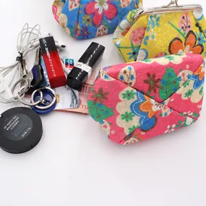 Detailed top view of embroidered coin purses with keys, lipstick, and cards capacity